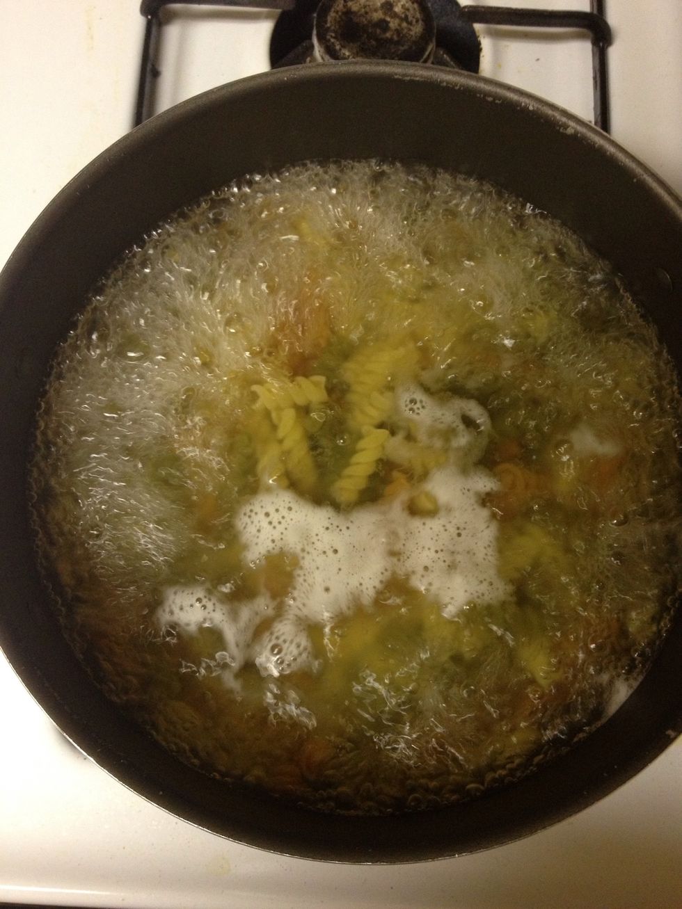 Fill boiler with enough water and bring to a boil. Add rotini and bring to a boil again. Boil rotini according to the time on the package. Mine called for 10-12 mins of boiling time. Stir frequently.