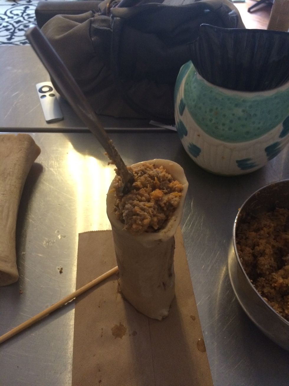 Fill bones with mixture using a fork or spoon. I put a paper bag underneath to catch the overflow.