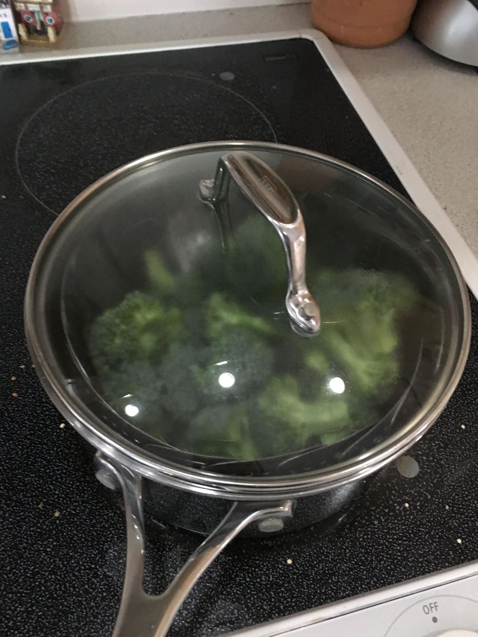 Fill bottom of medium pot with water, place steamer in the pot then place broccoli on steamer. Steam for 5 minutes.