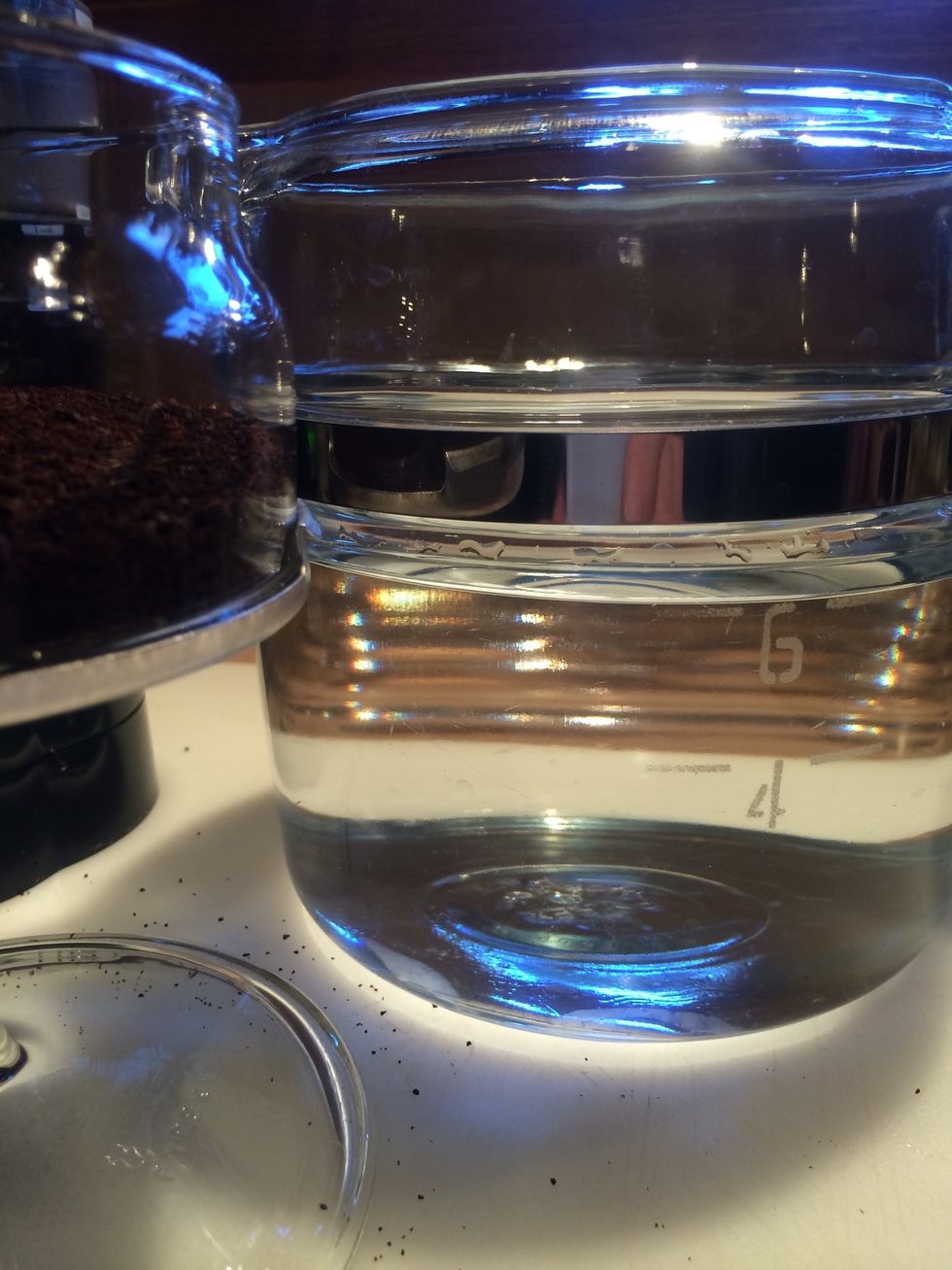 Fill coffee pot with cold water.