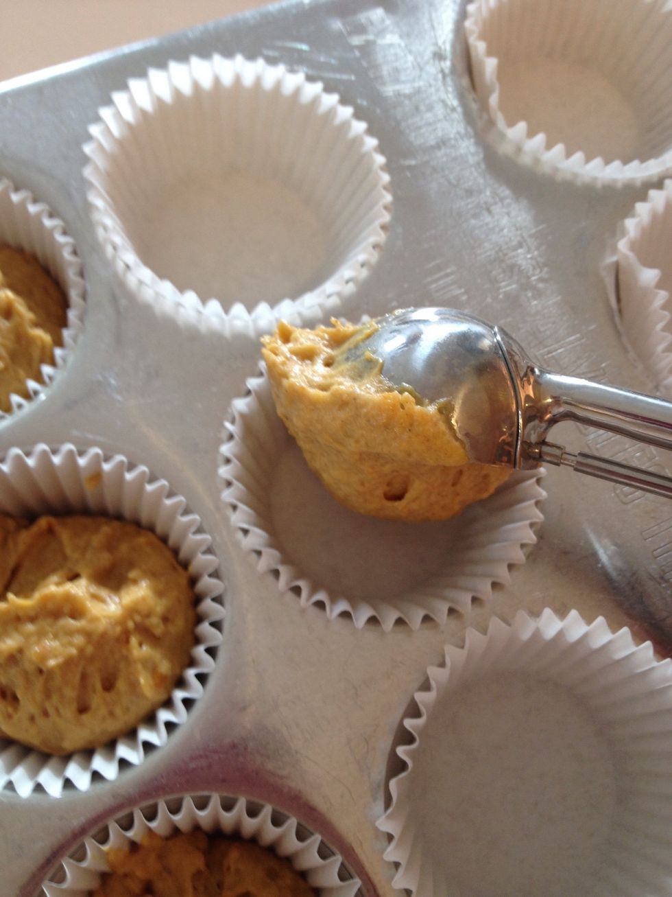 Fill cupcake liners 2/3 full with batter - using an ice cream scoop makes this easier and less messy!