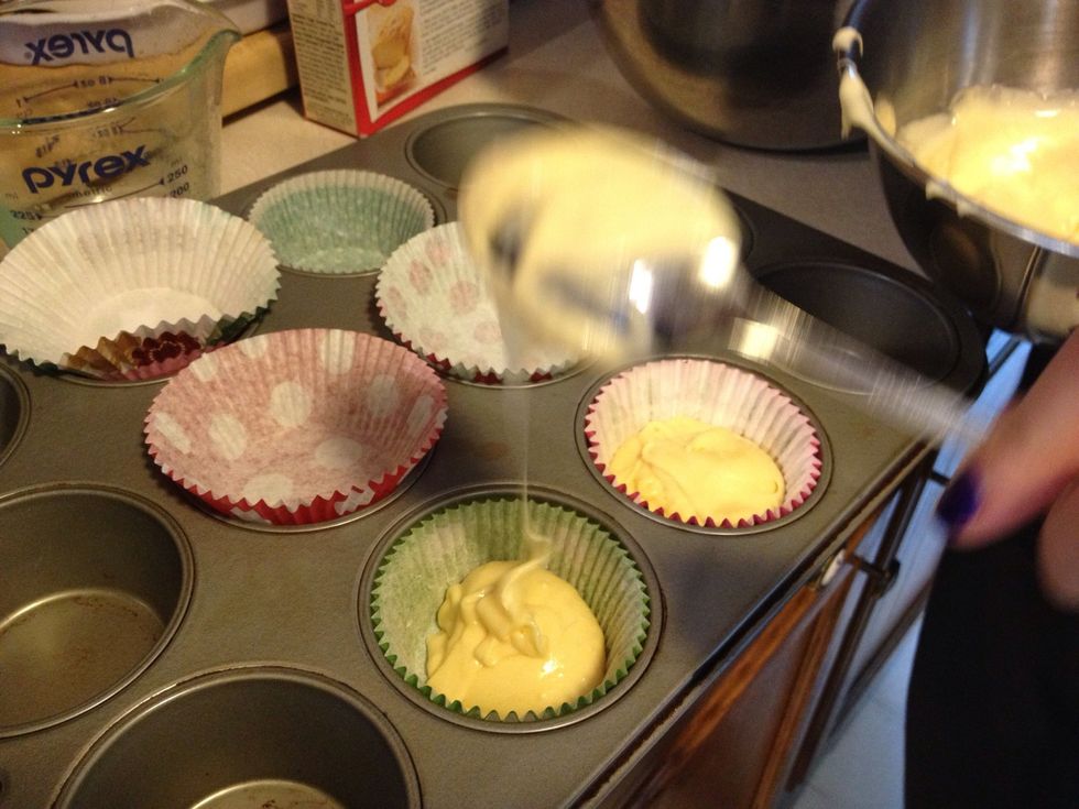 Fill cupcake linings half way with cake mix
