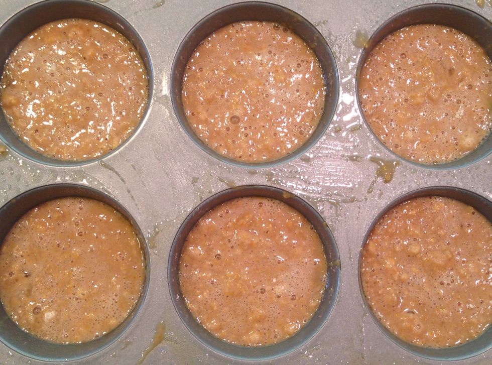 Fill deep muffin tins about 3/4 full. This recipe makes 6 extra large muffins or about a dozen regular sized muffins.