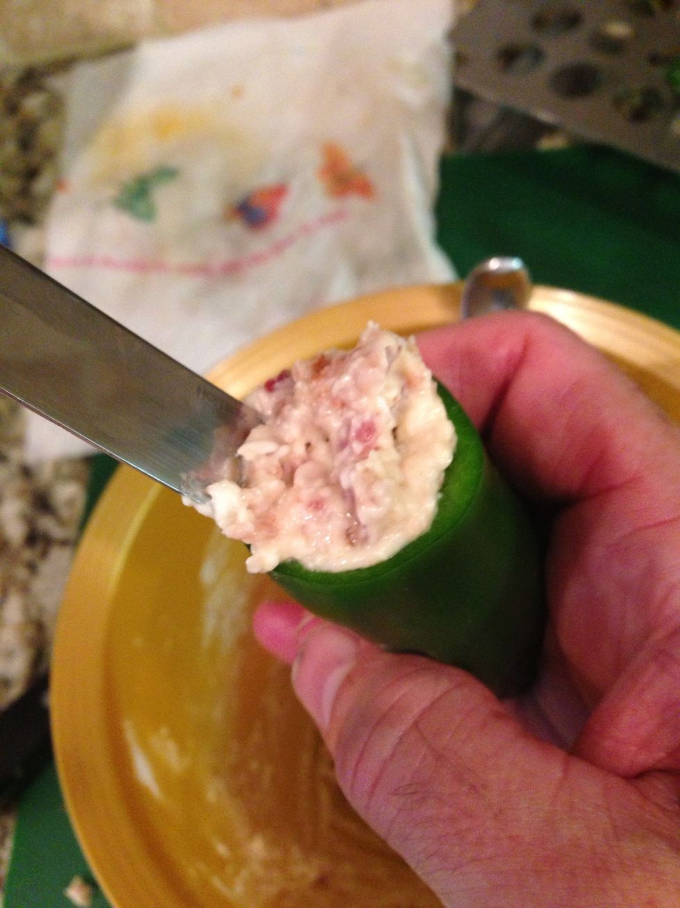 Fill each of the peppers with the mixture