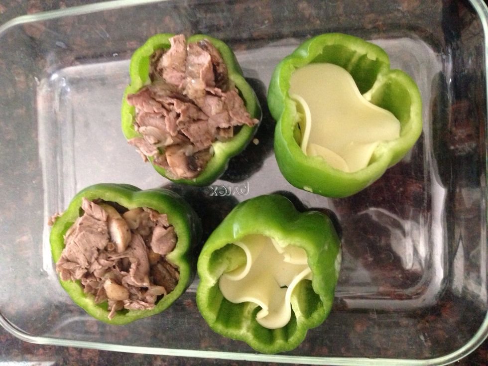 Fill each pepper with the beef mixture until all used and evenly distributed.