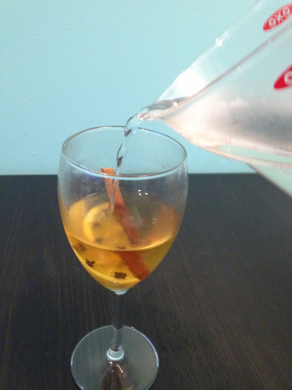 Fill glass with hot (not boiling) water. Ideally you want to add 8 ounces, so you have a 4:1 ratio of hot water to whiskey.