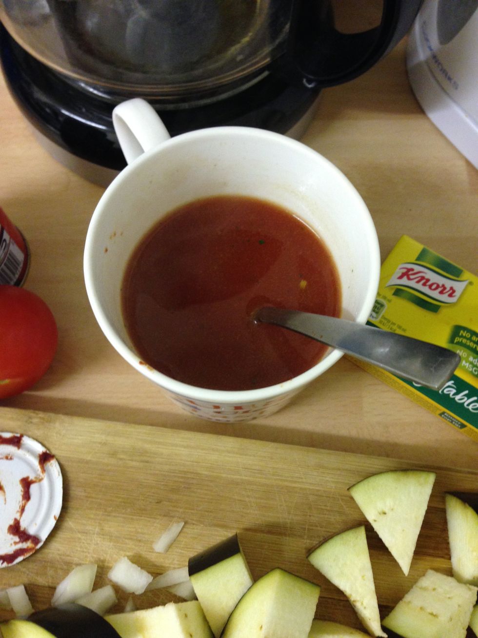 Fill half the mug with hot water and stir