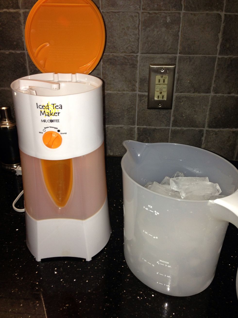 Fill iced tea pitcher with water up to the fill line for 3 quarts of iced tea. Add ice to the fill line for 3 quarts of iced tea.