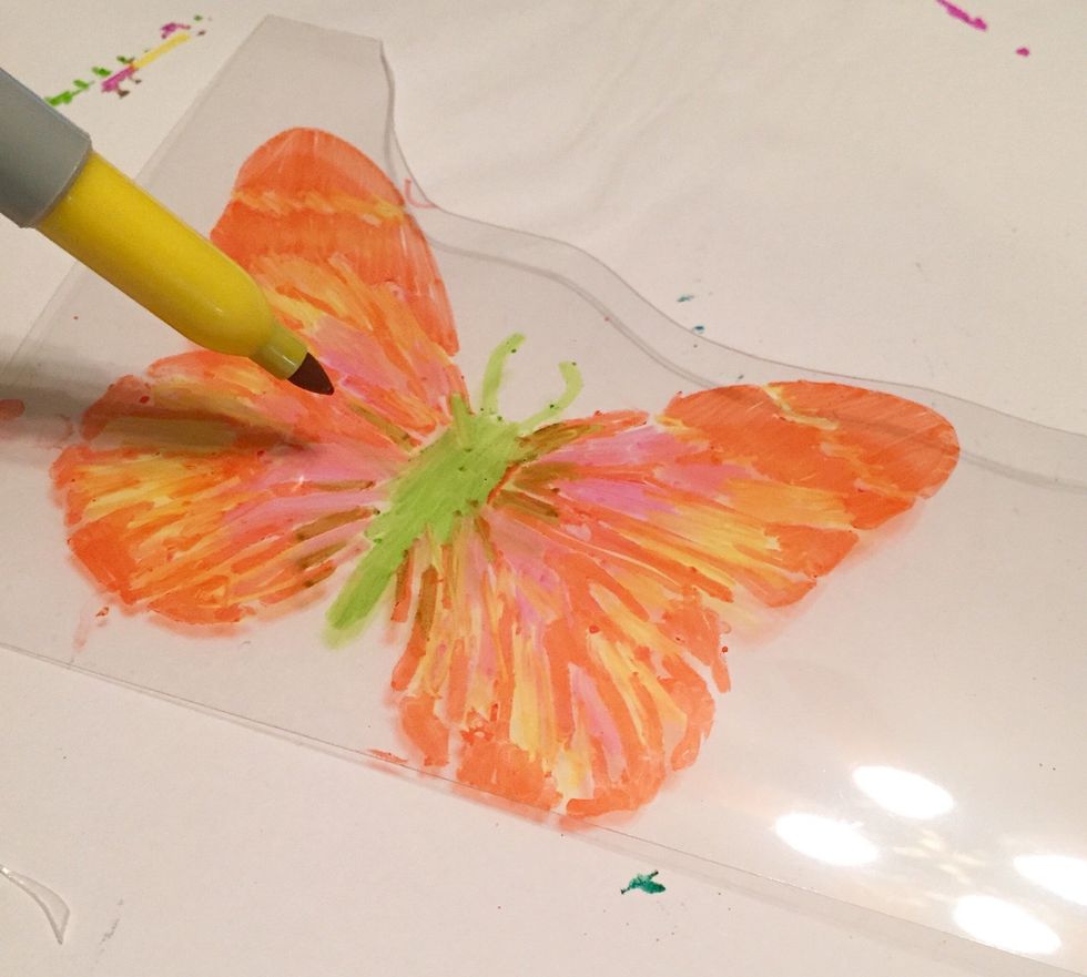fill in body with Lime Sharpie and use Yellow and Hot Pink Sharpies to add colors to the base design.
