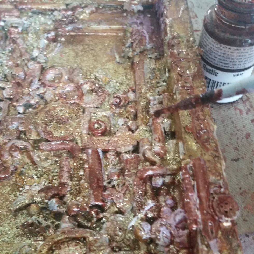 Fill in the deep crevices with a dark color with Iron Chalkboard Mist and Rustic Glimmer Glam to help give dark tones to offset the light tones on top of the layers.