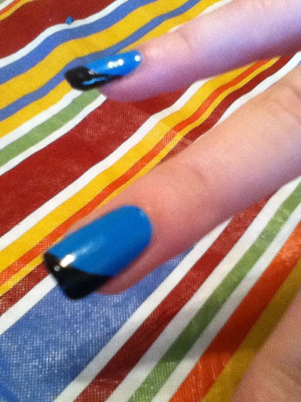 Fill in the nail with the black polish. This black tip will compliment your black dress.