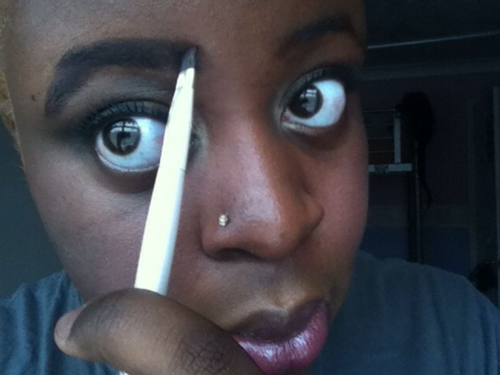 Fill in the outline with dark eyeshadow using your angled brush using a stroke by stroke technique so it doesn't look too harsh