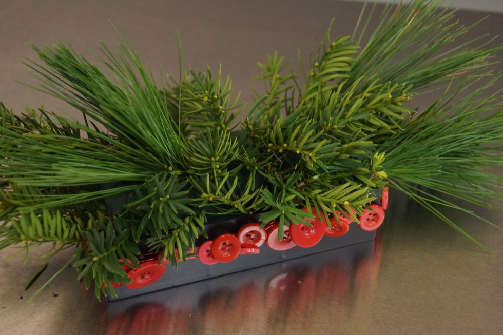 Fill in with other holiday greenery.