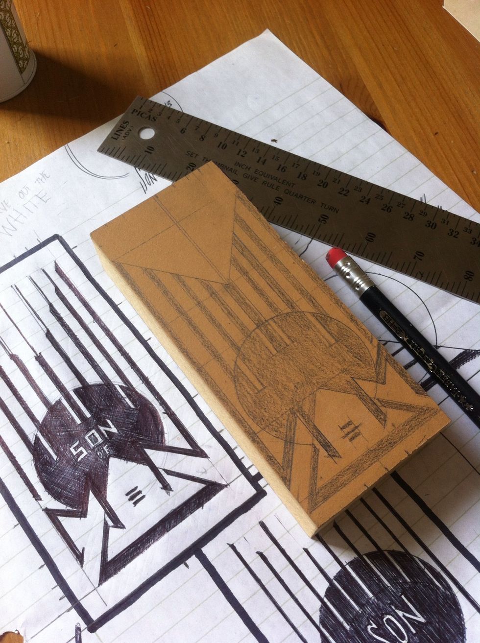 fill in your design with pencil once its all traced out. remember that text needs to be backwards on a stamp. use your brain to write your letters backwards. if you can't do this. maybe just brew beer