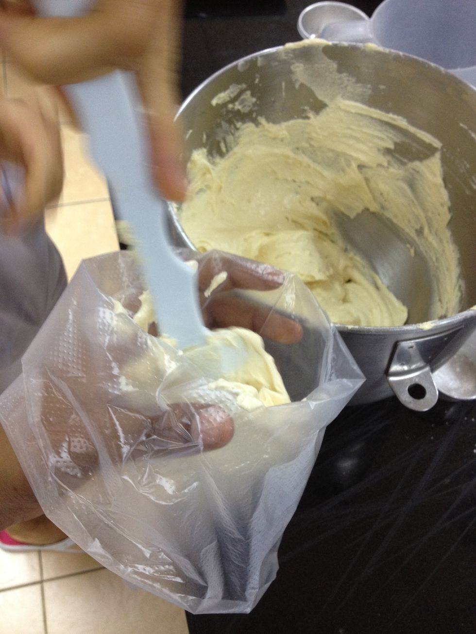 Fill it in a piping bag. (You could skip this and fill them with a cookie scoop or just tablespoons)