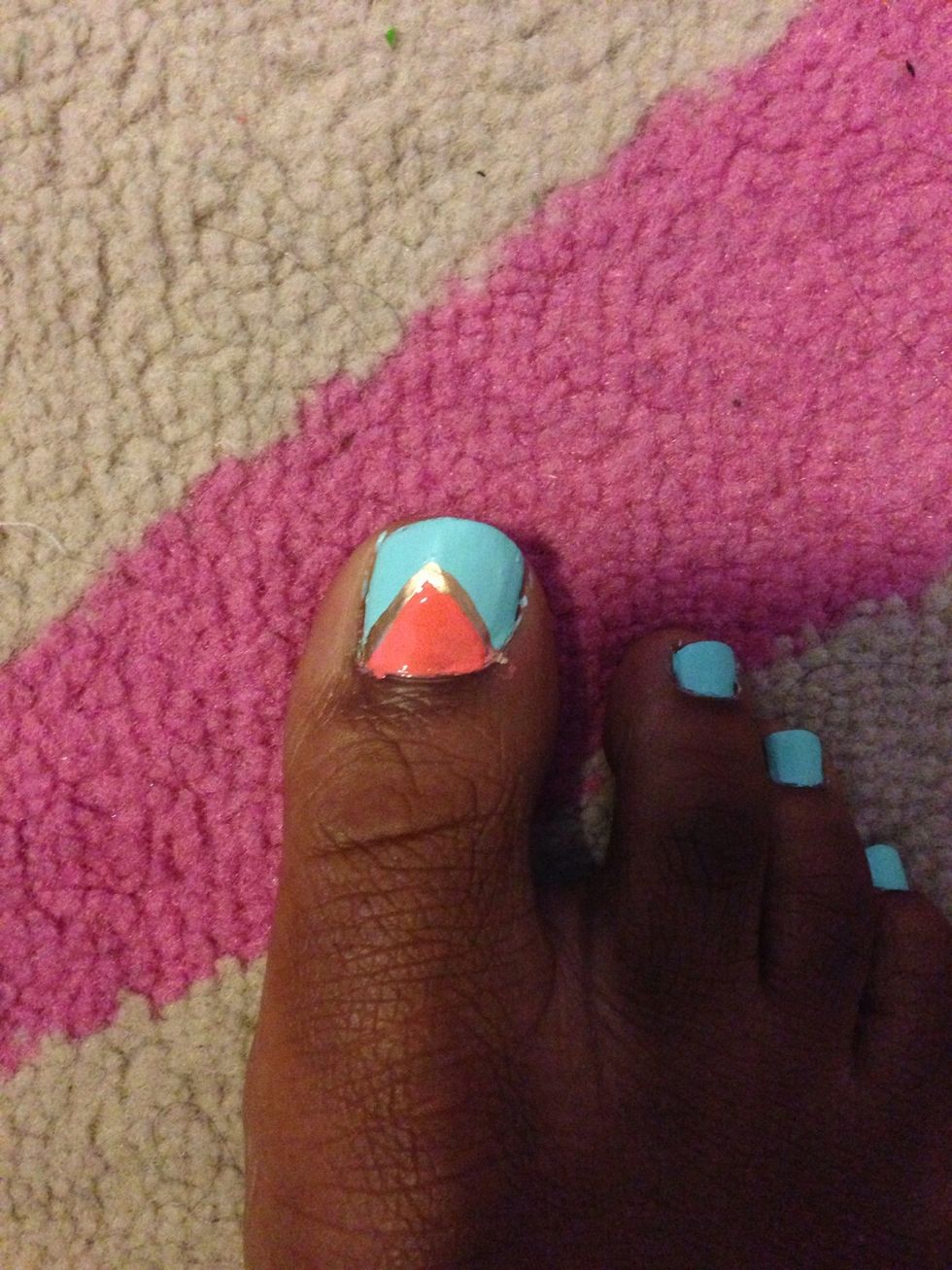 Fill it in. Take your nail art brush and out line it with an opposite color such as gold.