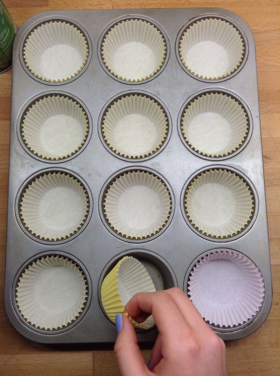 Fill muffin tin with muffin or cupcake cases.