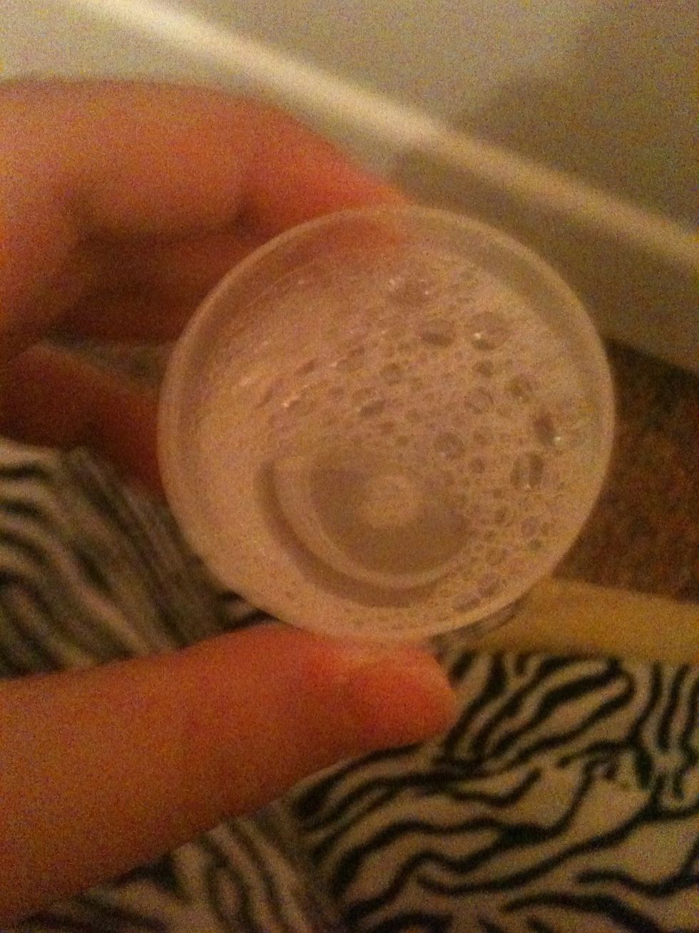 Fill one of the lids up with water