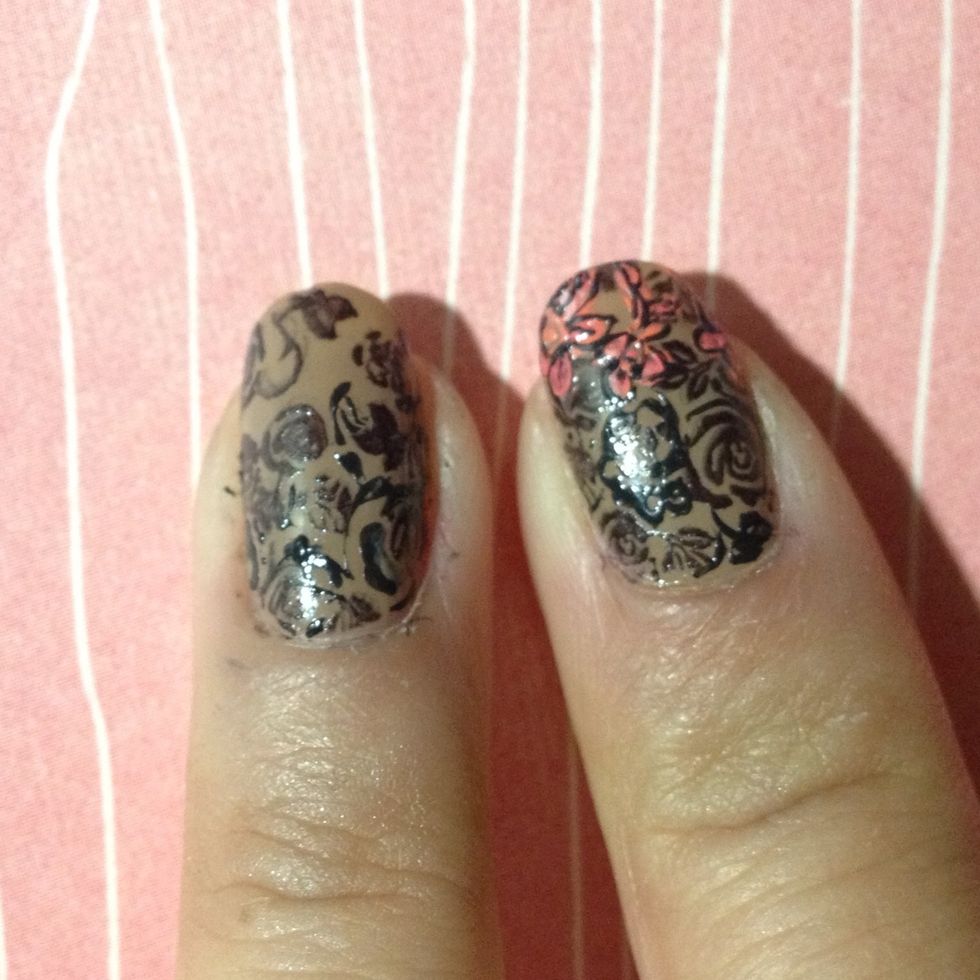 Fill out the negative space with additional lines, leaves and swirls with black polish. You just need to fill 3/4 of it because the tip will be covered by another design.