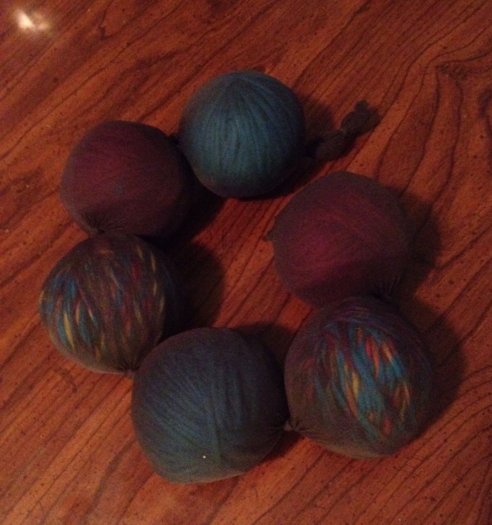 Fill panty hose and cut off end.