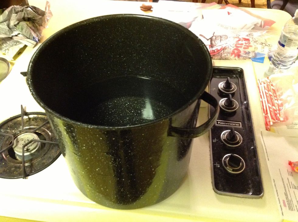 Fill pot half way with tap water and turn range to medium high heat