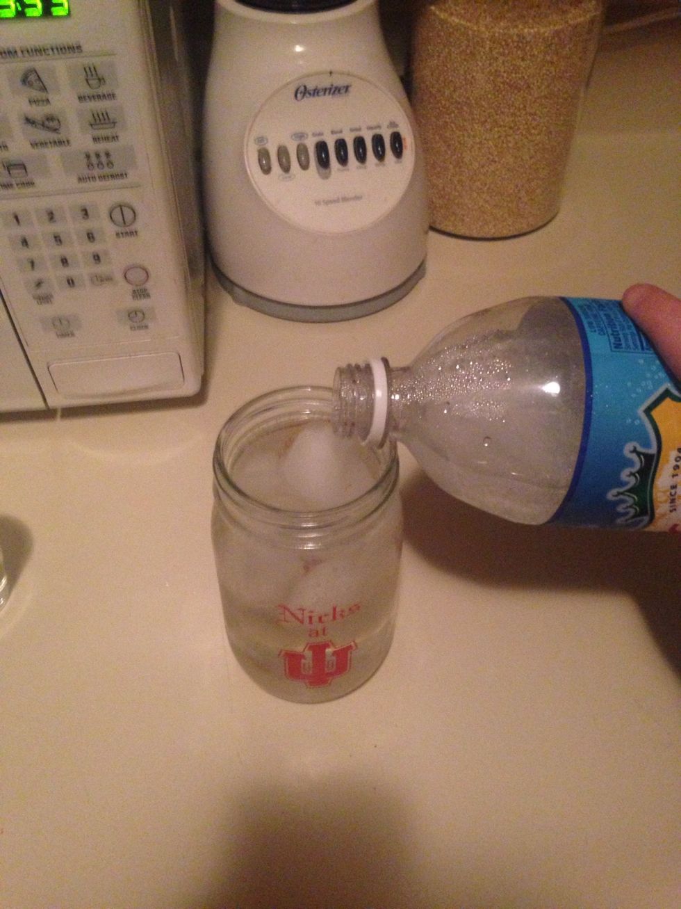 Fill rest of cup with club soda