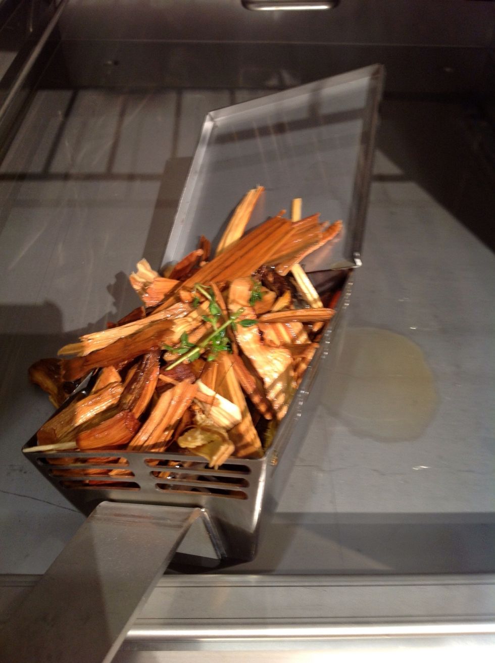 Fill smoke box with water soaked wood chips, add fresh cilantro.