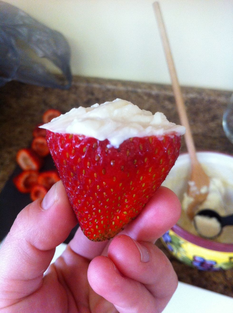 Fill strawberry and leave a little filling on top for the graham cracker to grab onto.