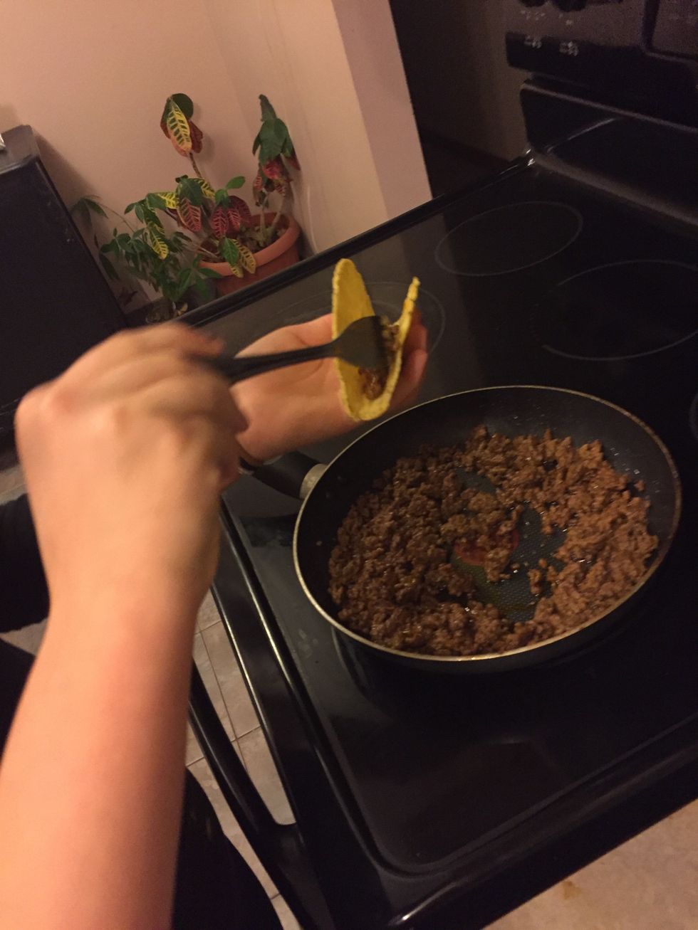 Fill taco shells with the cooked ground meat.
