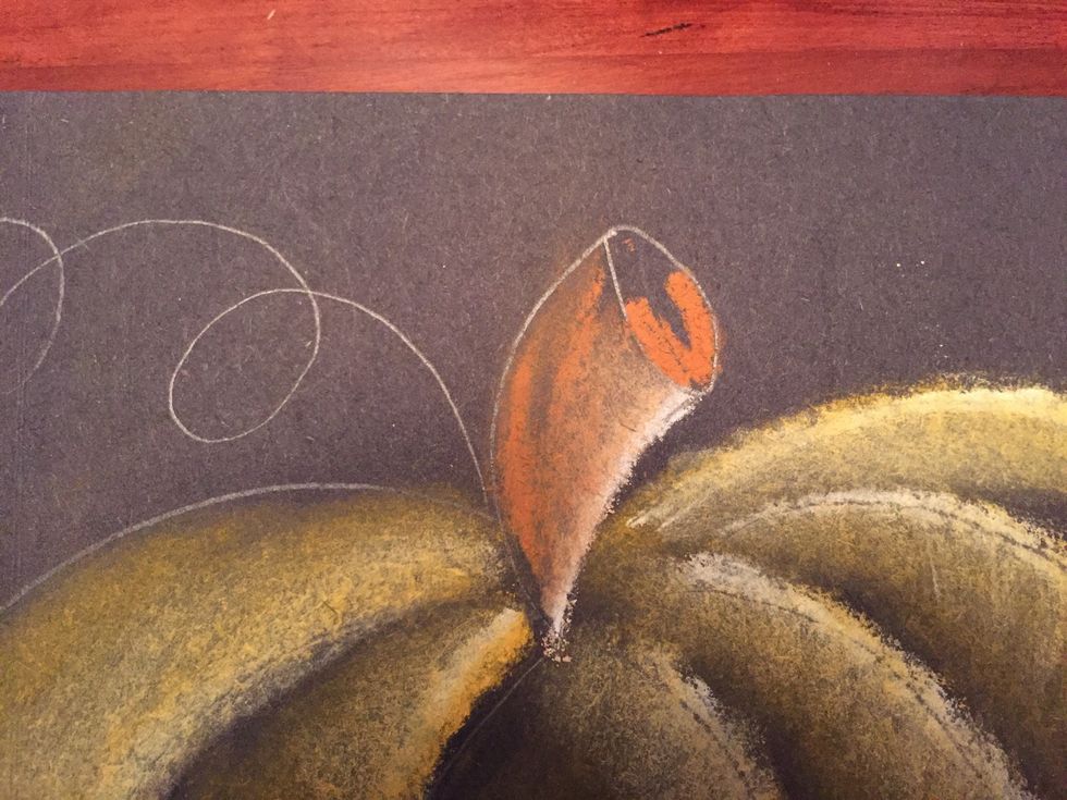 Fill the bottom half of the oval with brown.