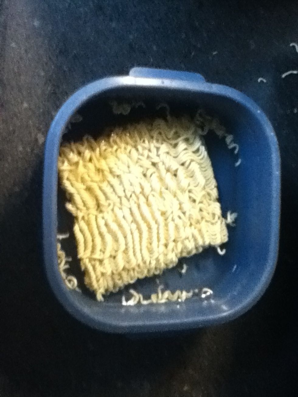 Fill the bowl halfway with water and add the ramen noodles