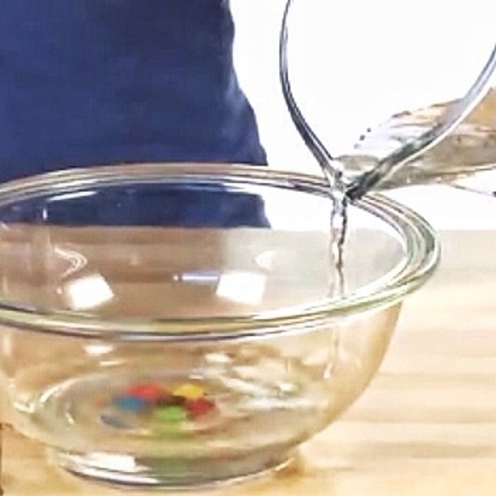 Fill the bowl with enough water to submerge the candies.