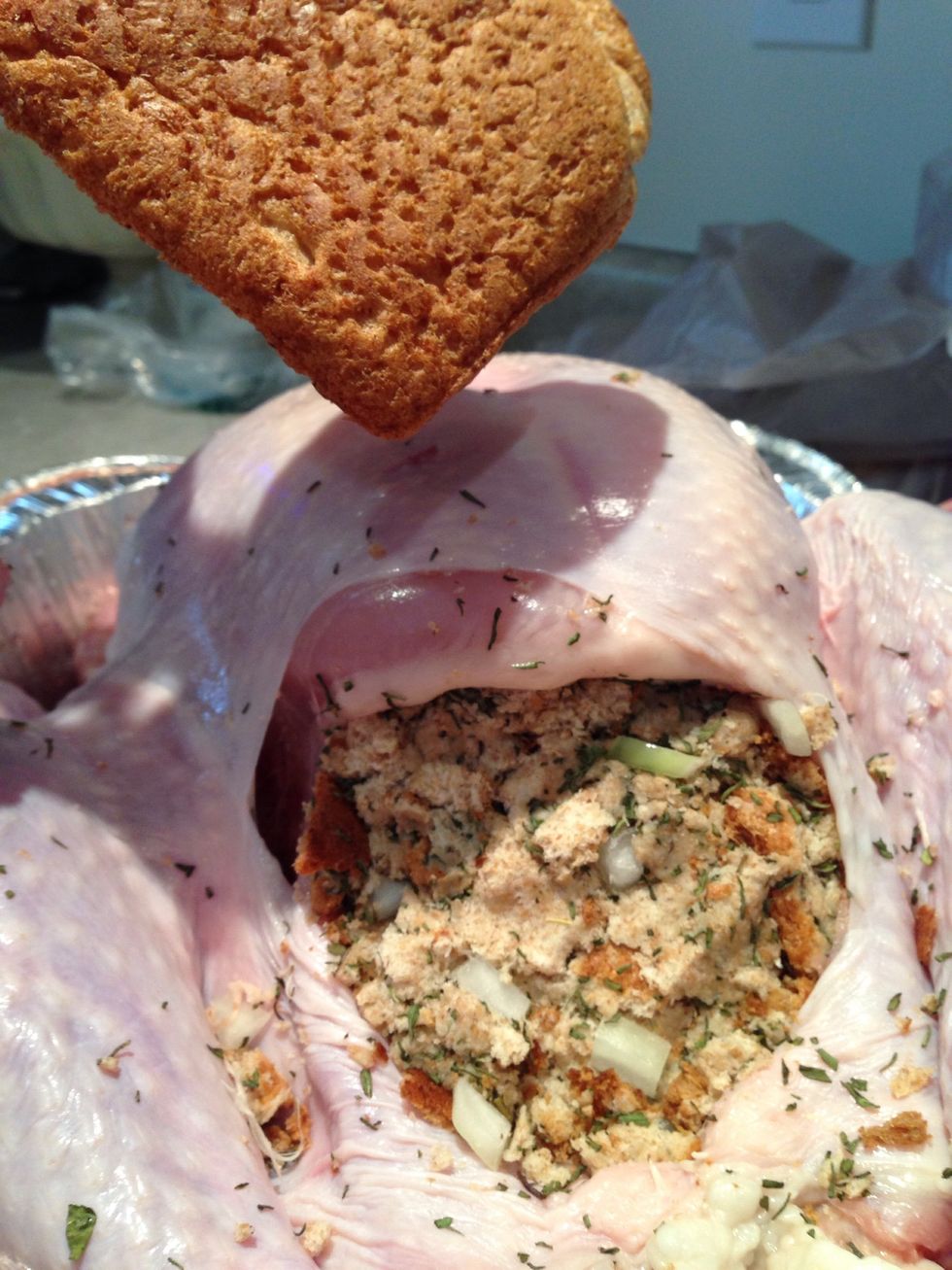 Fill the cavity until there is a little space left. If you have extra stuffing you can fill the small cavity of the bird.
