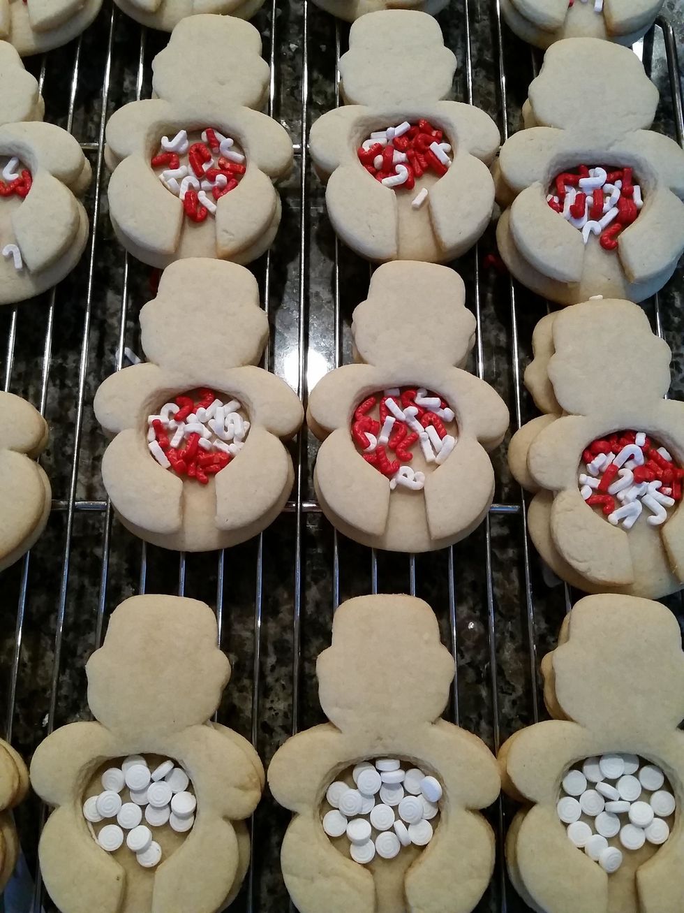 Fill the circle with your choice of holiday sprinkles. Some I have all white for snowballs, others we chose candy cane shaped sprinkles.