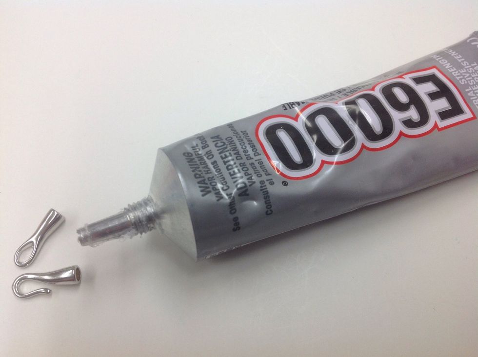 Fill the cups of your closure pieces about 1/2 with E6000 or similar industrial strength adhesive. Allow to cure for 2 minutes.