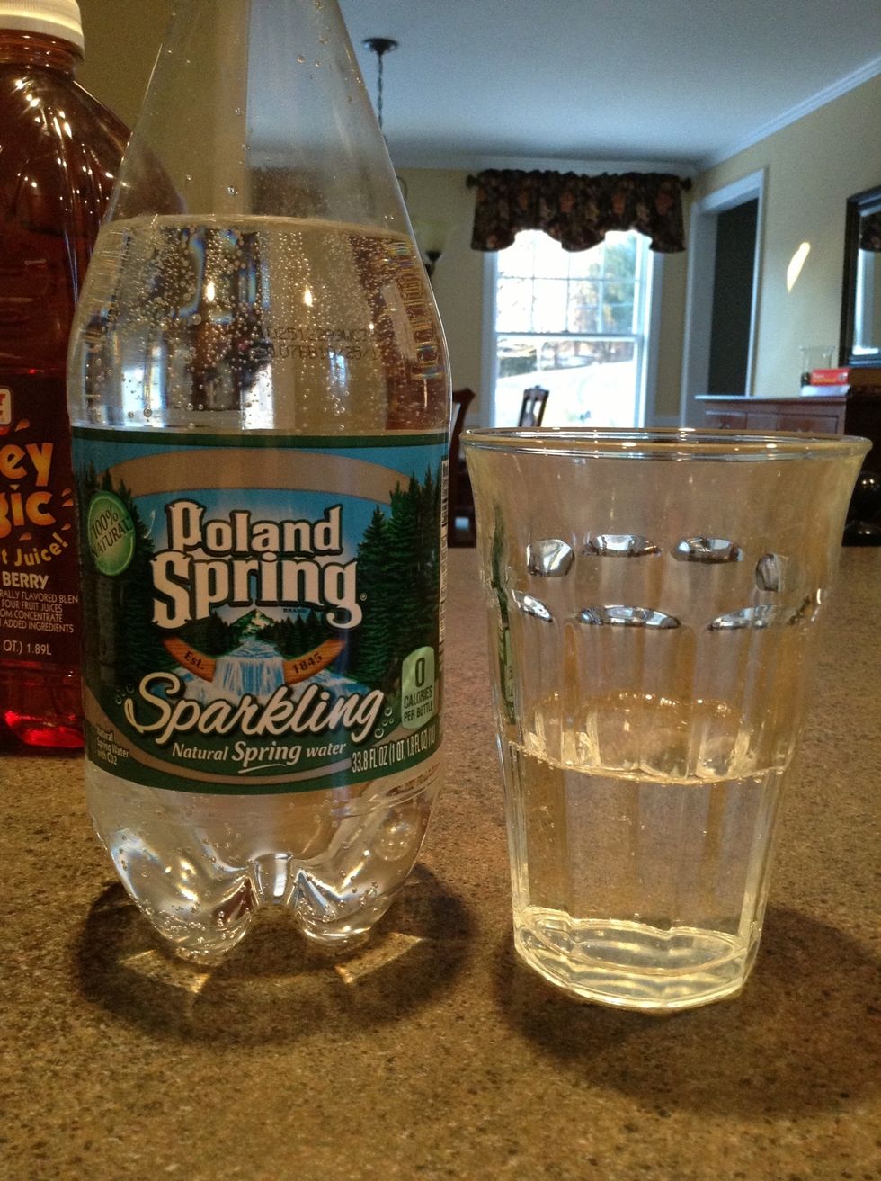 Fill the glass about halfway with your sparkling water. I like a little less, but it depends on how much fruitiness you want to come through. Look at all those bubbles!