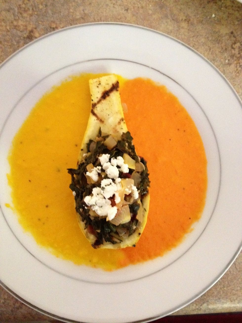 Fill the grilled squash with the Swiss chard mixture and top with goat cheese. Place gently in the middle of the plate.