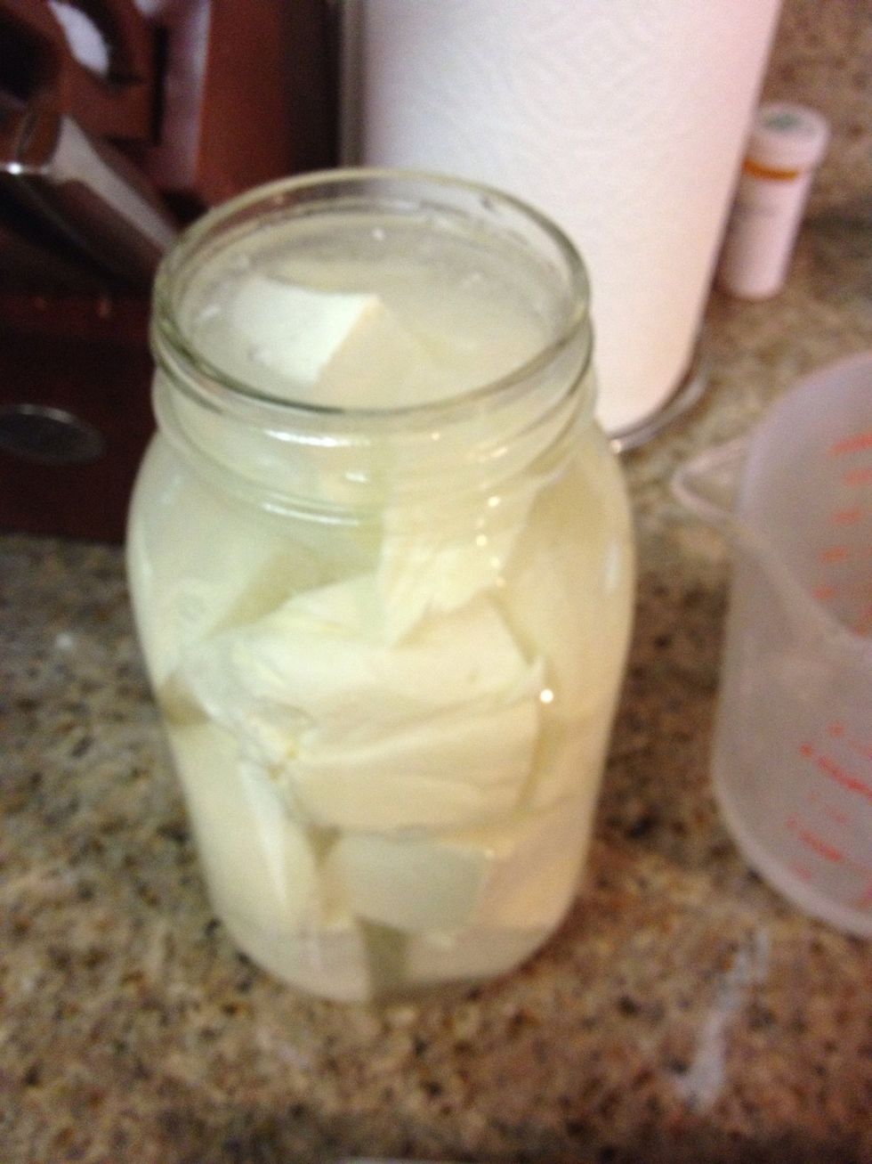 Fill the jar almost to the brim. This water/salt ratio gave me about a 6.5% salt solution plus all the salt already on the cheese bumped it up to ~8%. This is on the low end of salt brines.
