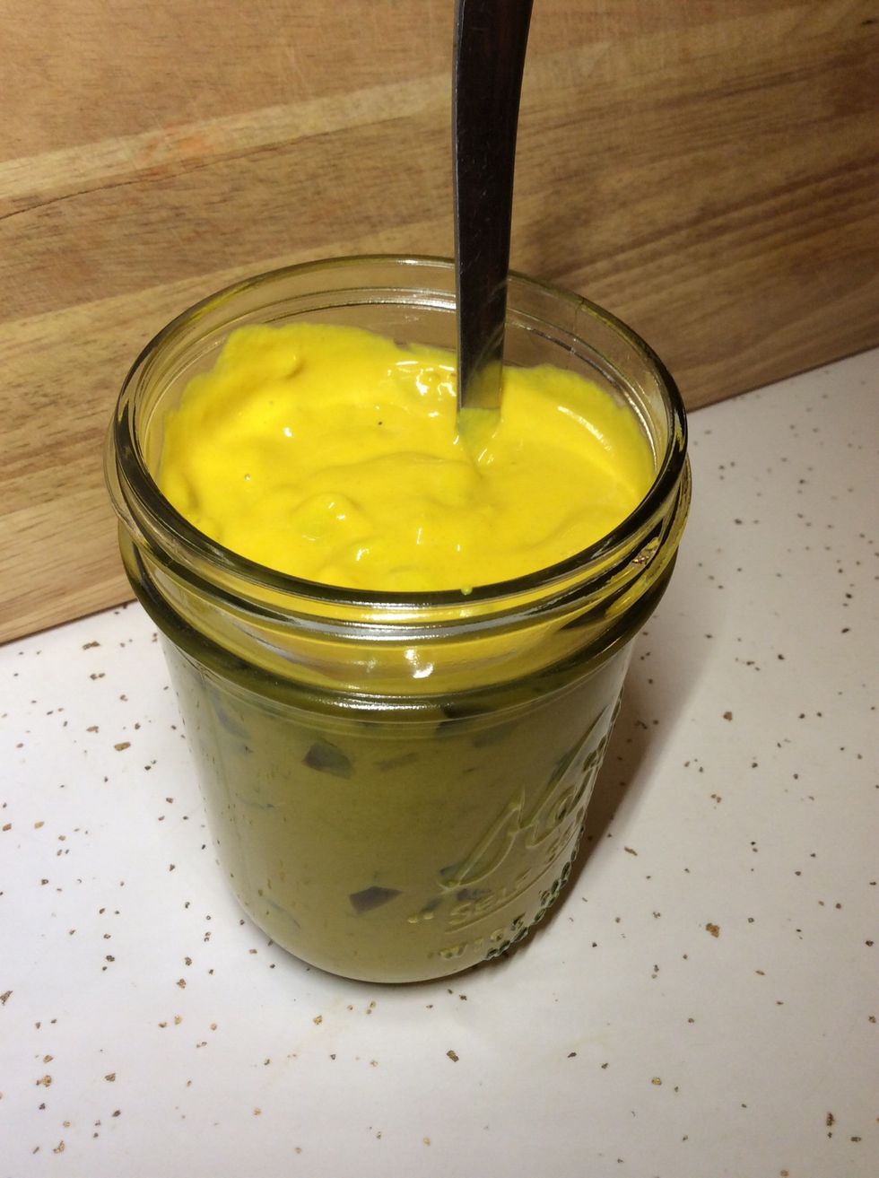 Fill the jar to about half an inch below the lid and mix again.