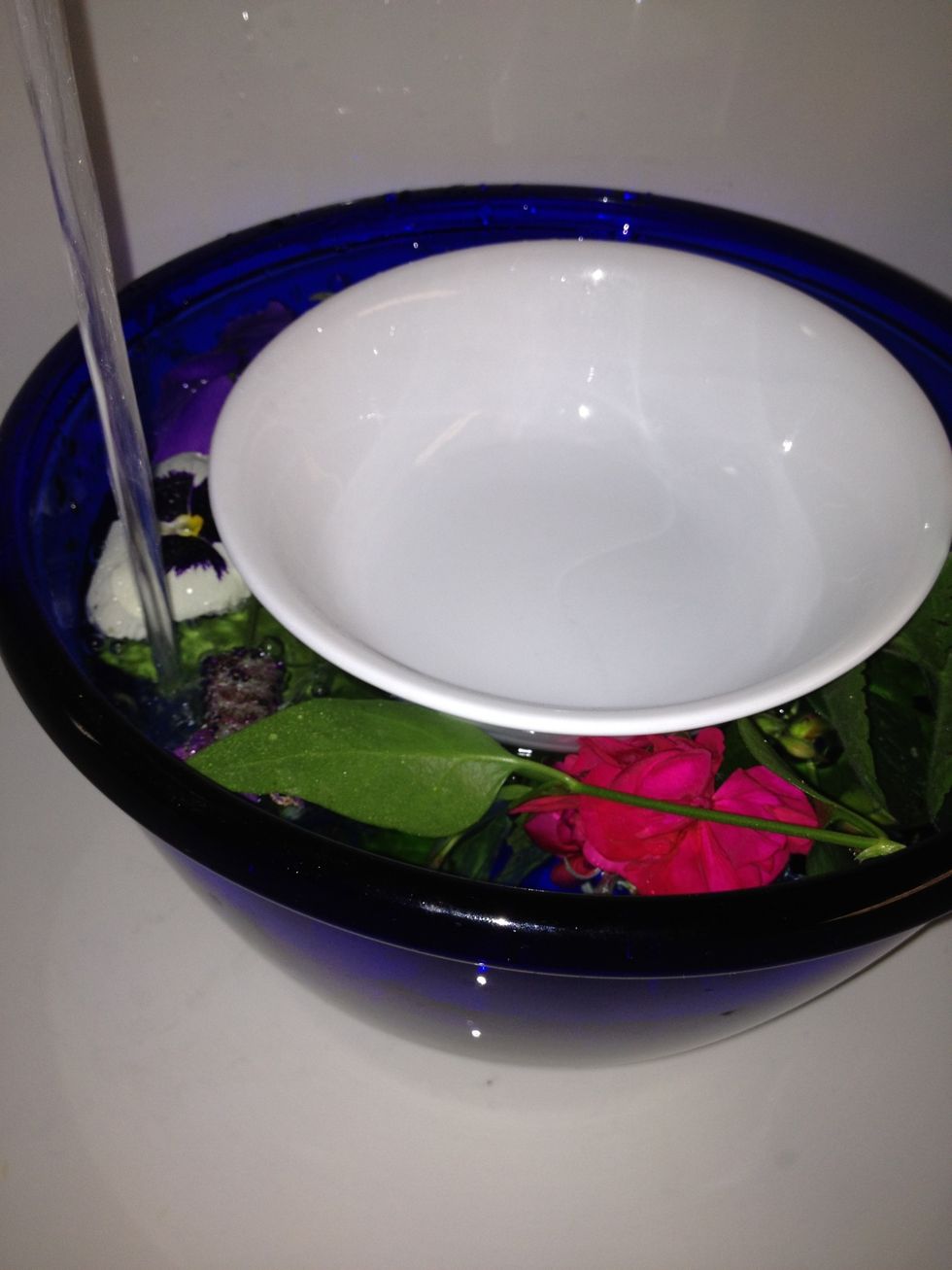 Fill the large bowl with water.