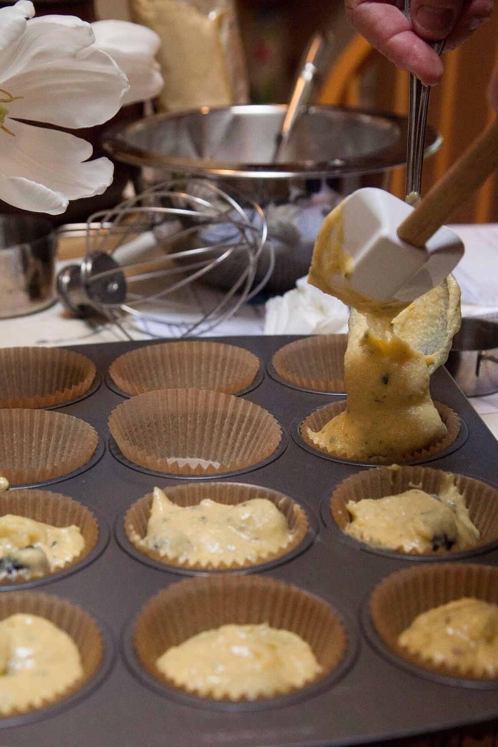Fill the muffin cups part way, the muffins will rise. Pop the muffins into the center of the oven and bake them for 40 minutes. While the muffins are baking: Chop more rosemary until you have 1/3 cup