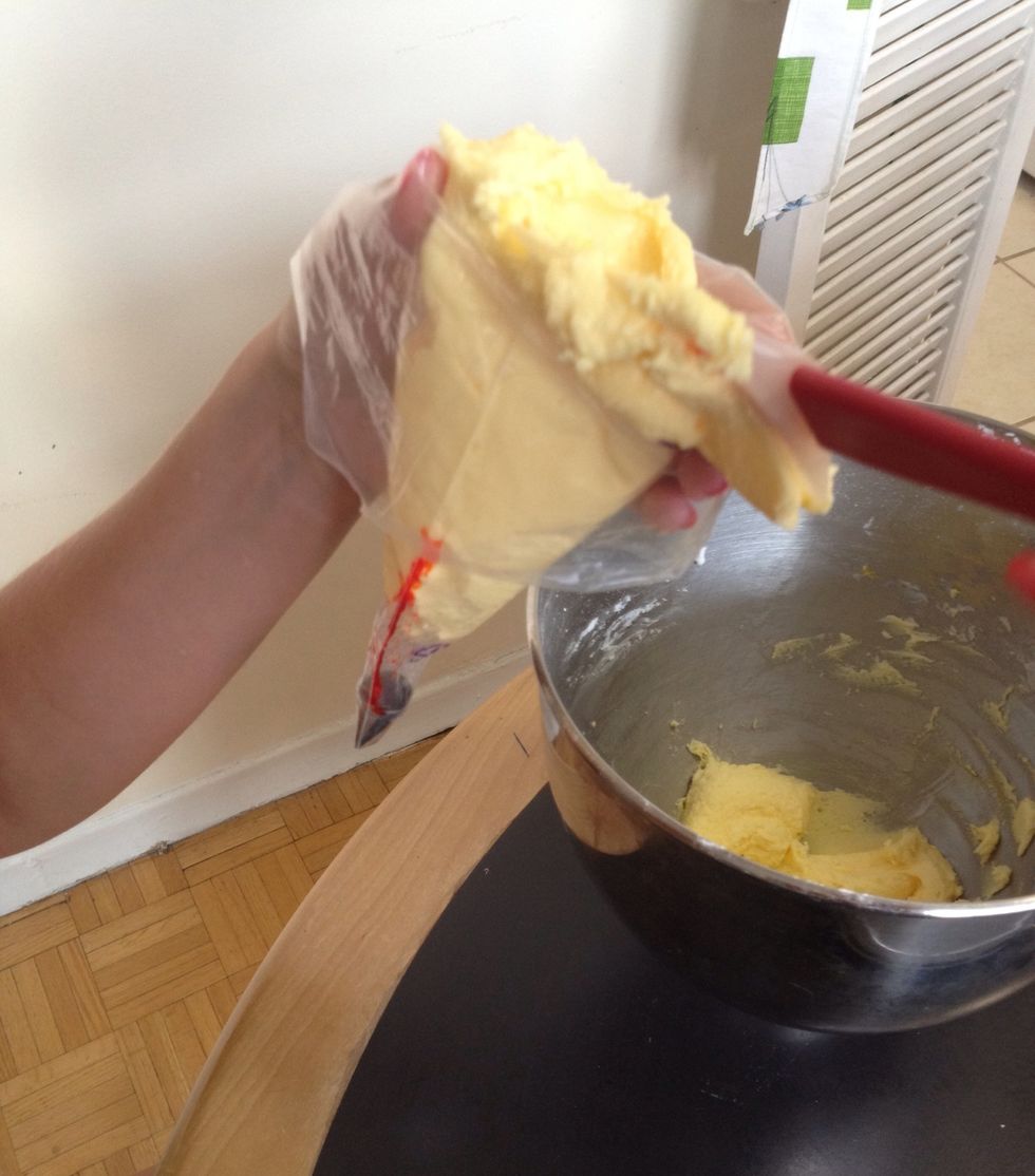 Fill the piping bag and twist the end so there are no air pockets.