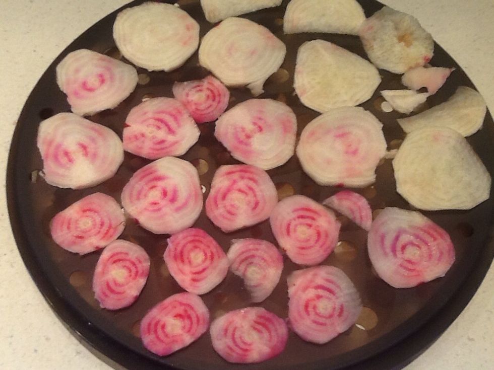 Fill the plate with the very thin, even slices.