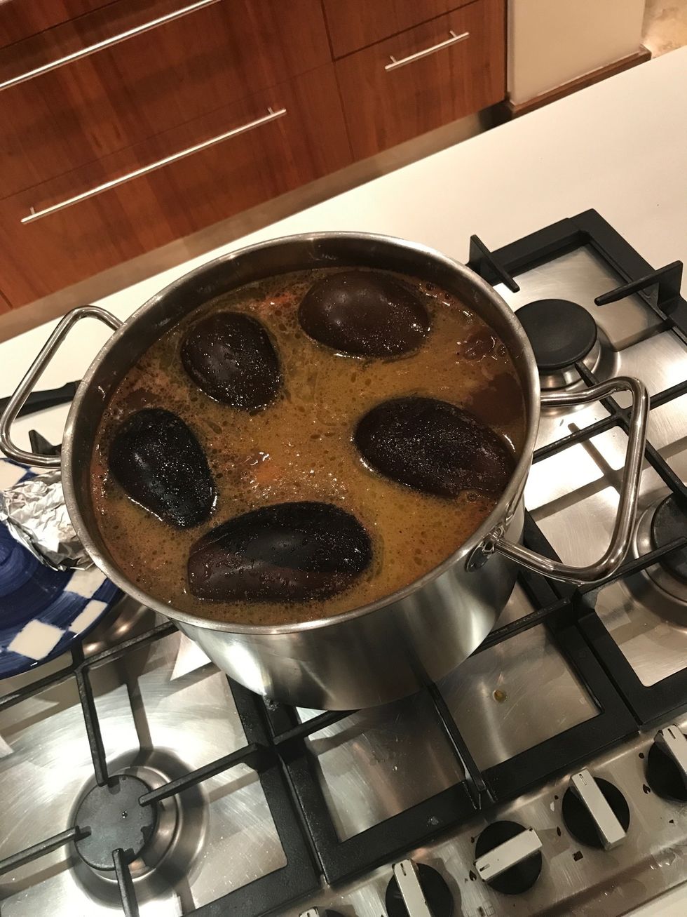 Fill the pot with hot water, add 80g of butter, a table spoon of Lebanese herbs, some salt and put tomato paste in the pot and put the pot on the stove and cook for 30 minutes on medium heat.