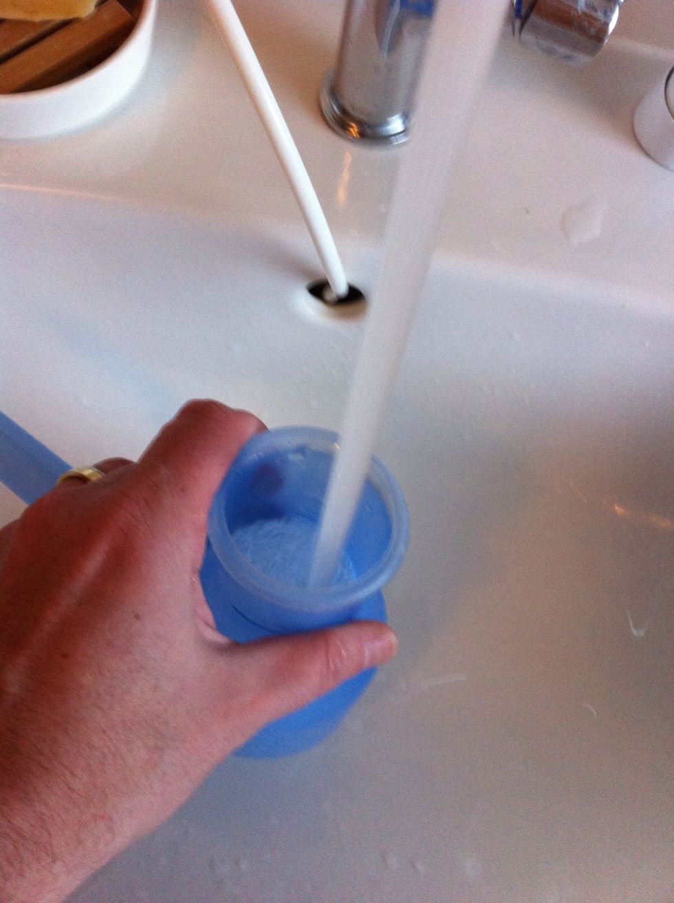 Fill the pot with warm water. My pot has a capacity of 444 ml. It is crucial to use water that's warm but not hot. It should feel comfortably warm when testing with your hand.