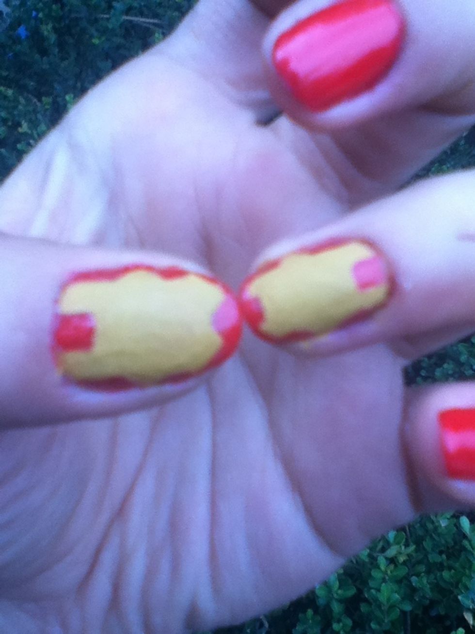 Fill the shape with the yellow nail polish and this is how it will look! You can use a toothpick  to fix the shape and define it better