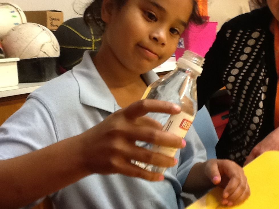 Fill the small drink bottle with water