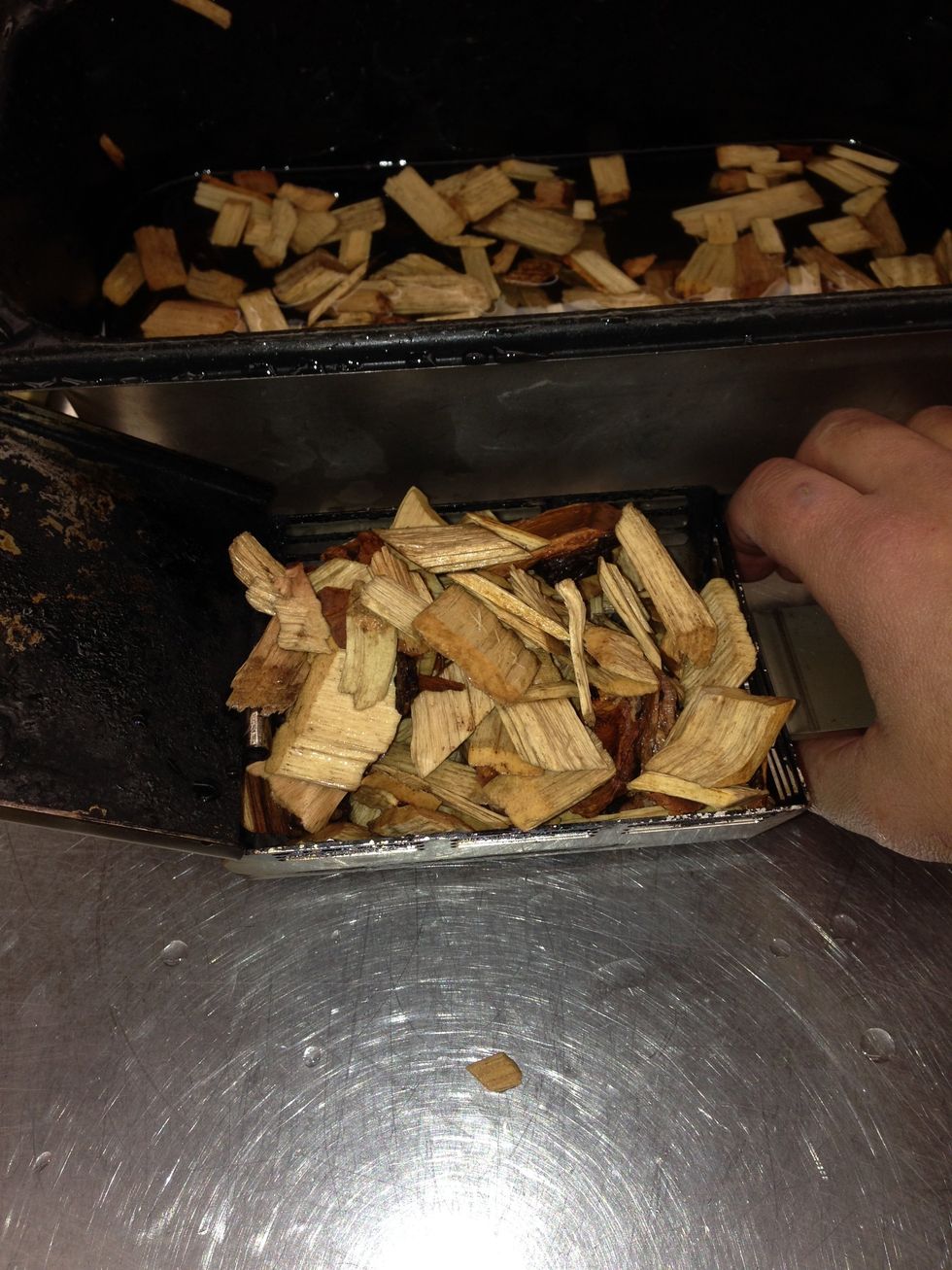 Fill the smoker box with 1.5 cups of hickory wood chips.