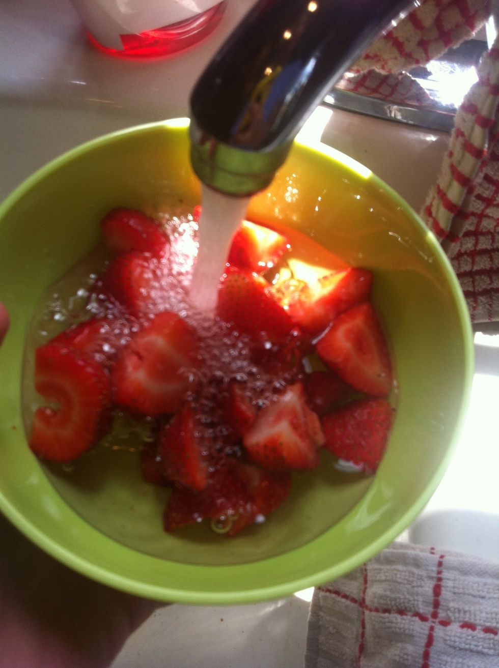 Fill the strawberry bowl until it is almost full.