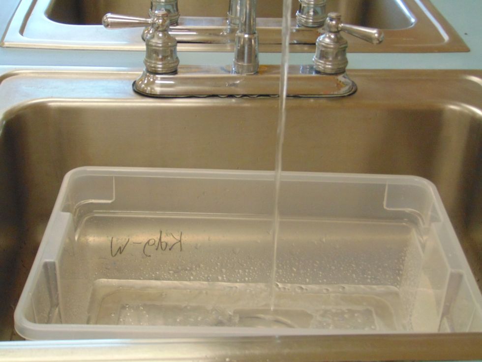 Fill the tub with cool water half way full.